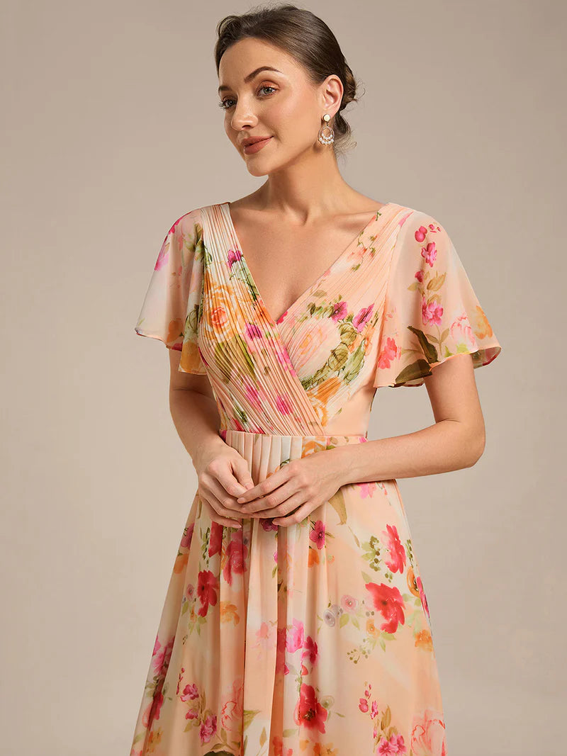 Peach fuzz elegant chiffon wedding guest dress with pleated bodice and ruffle detailing