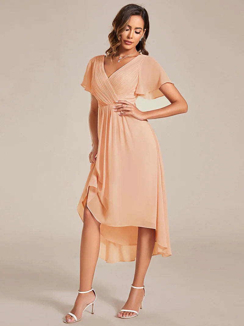 Peach elegant chiffon wedding guest dress with pleated bodice and ruffle detailing
