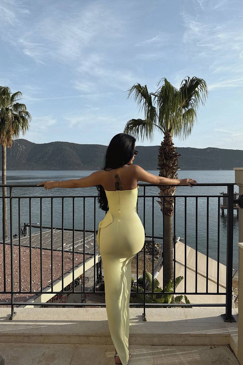 Strapless yellow maxi dress with 3D floral detailing and elegant side slit