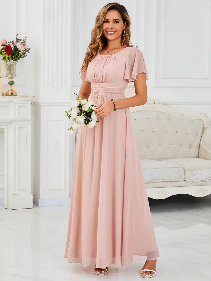 Round neck pink bridesmaid gown in a pleated design for elegant wedding looks