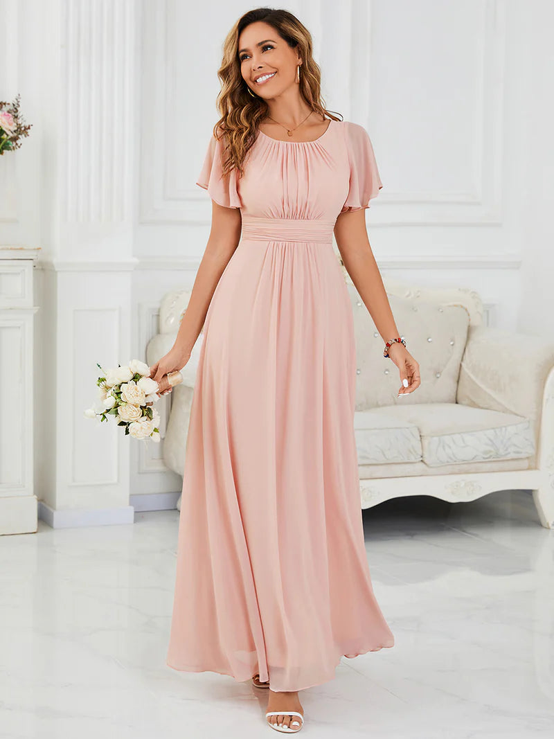 Round neck pink bridesmaid gown in a pleated design for elegant wedding looks