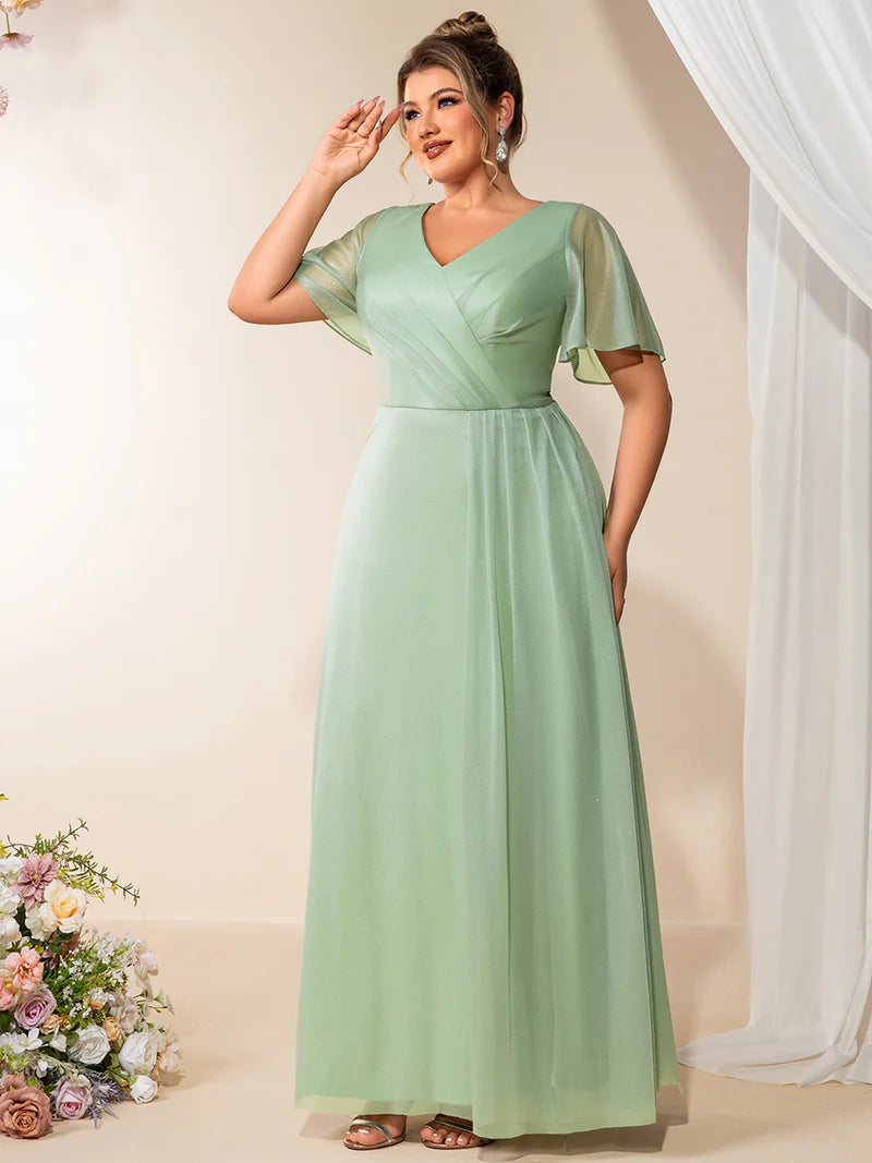 Plus size mint green evening dress with ruffle V-neckline, A-line silhouette, and short sleeves