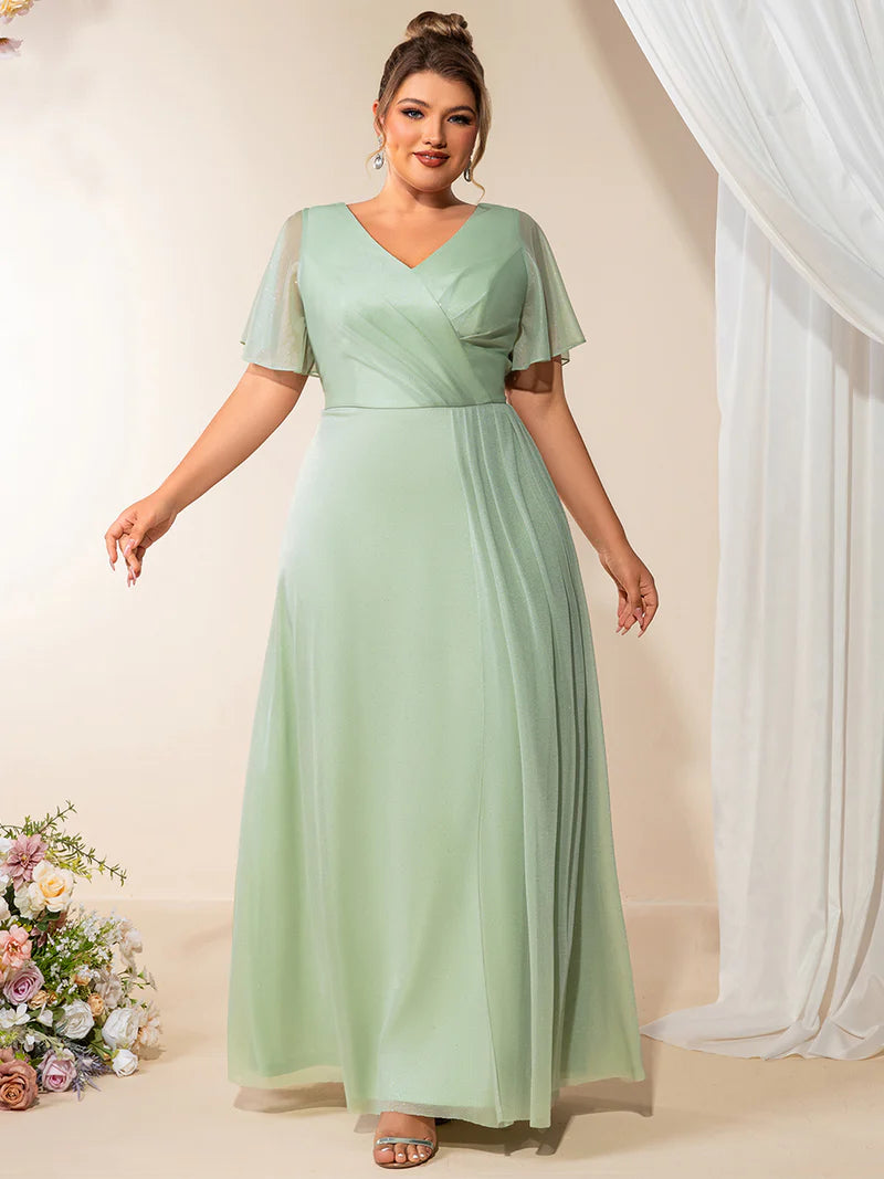 Plus size mint green evening dress with ruffle V-neckline, A-line silhouette, and short sleeves