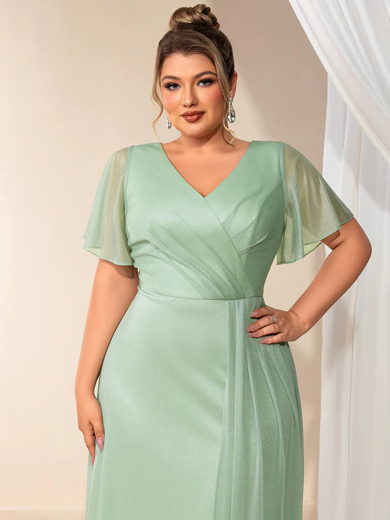 Plus size mint green evening dress with ruffle V-neckline, A-line silhouette, and short sleeves