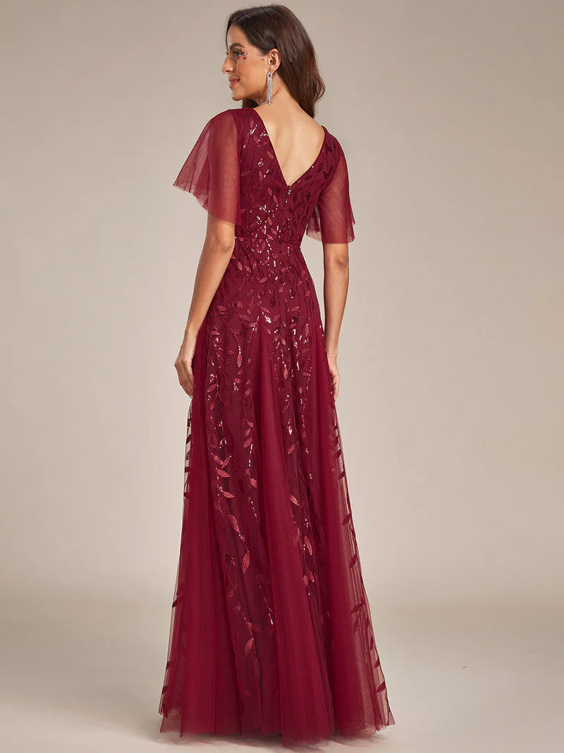 Romantic shimmery evening gown with V-neckline, ruffle sleeves, and floor-length maxi silhouette burgundy dress