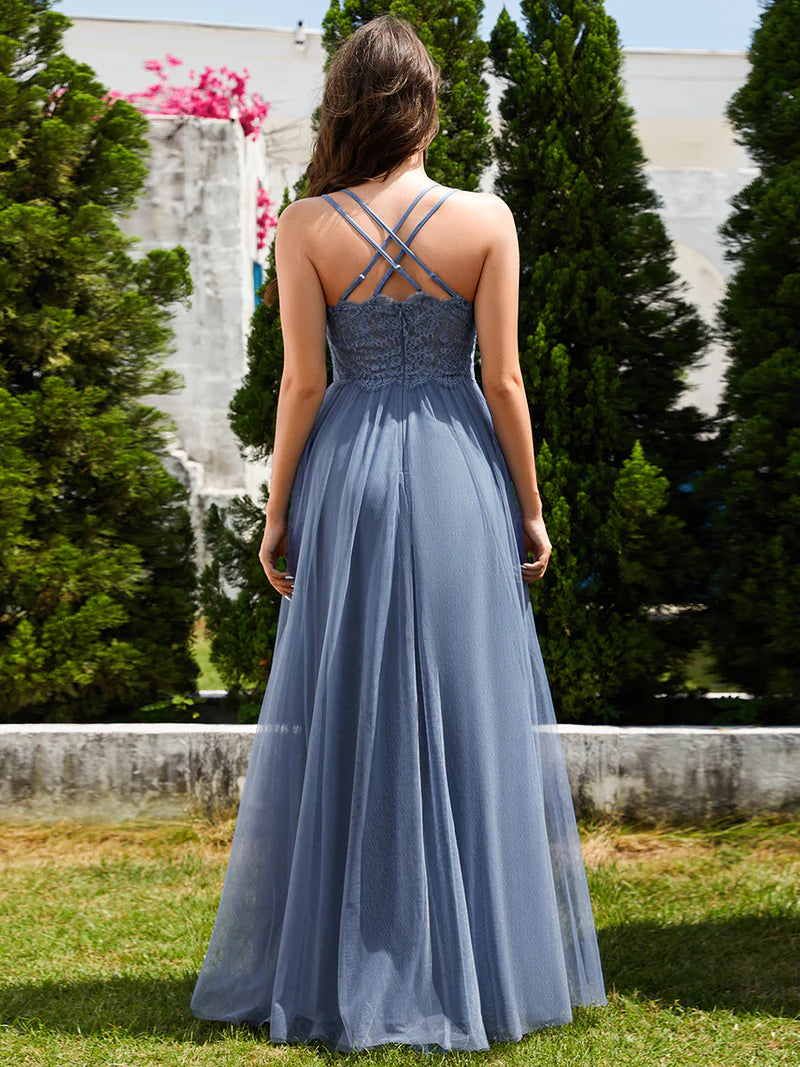 Romantic tulle dusty blue bridesmaid dress with spaghetti straps, lace halter neckline, and open back