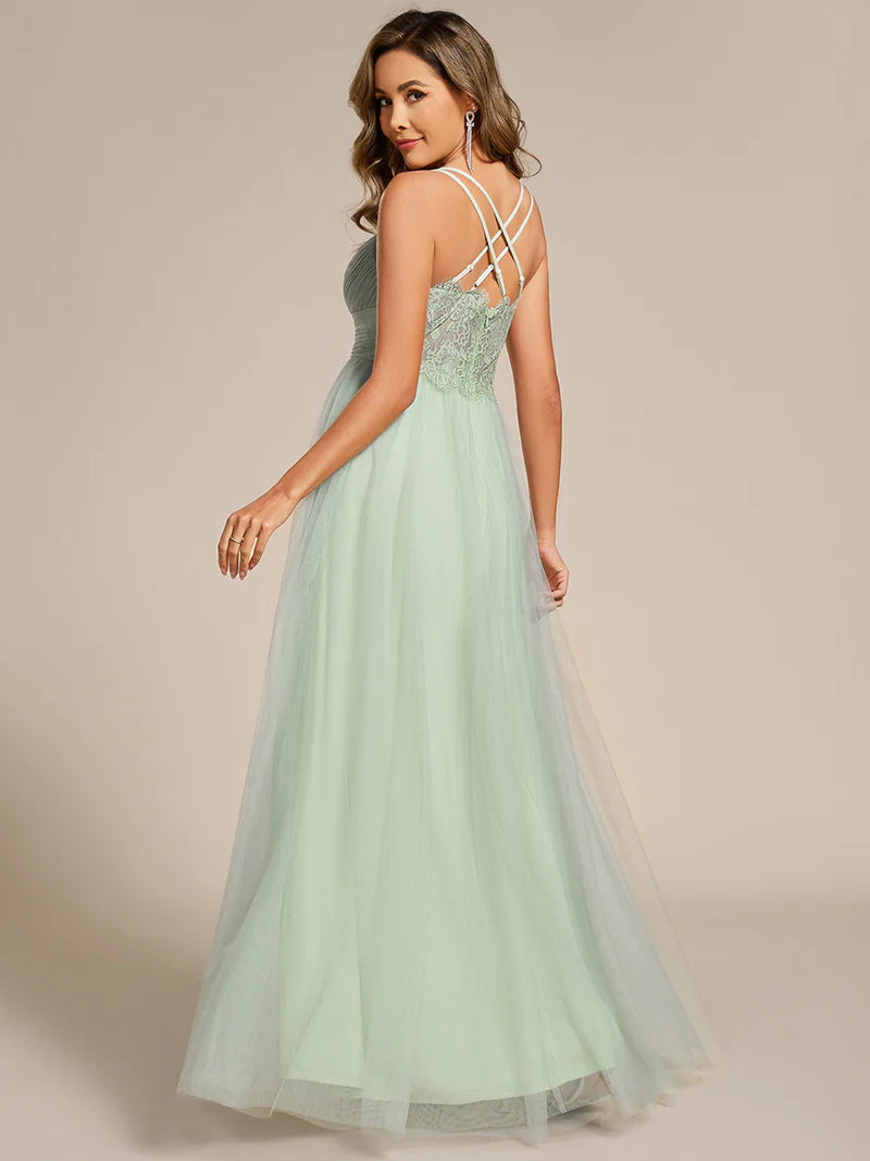 Romantic mint green blue bridesmaid dress with spaghetti straps, lace halter neckline, and open back