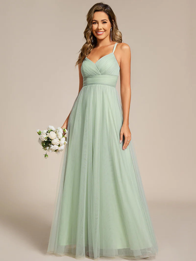 Romantic mint green blue bridesmaid dress with spaghetti straps, lace halter neckline, and open back