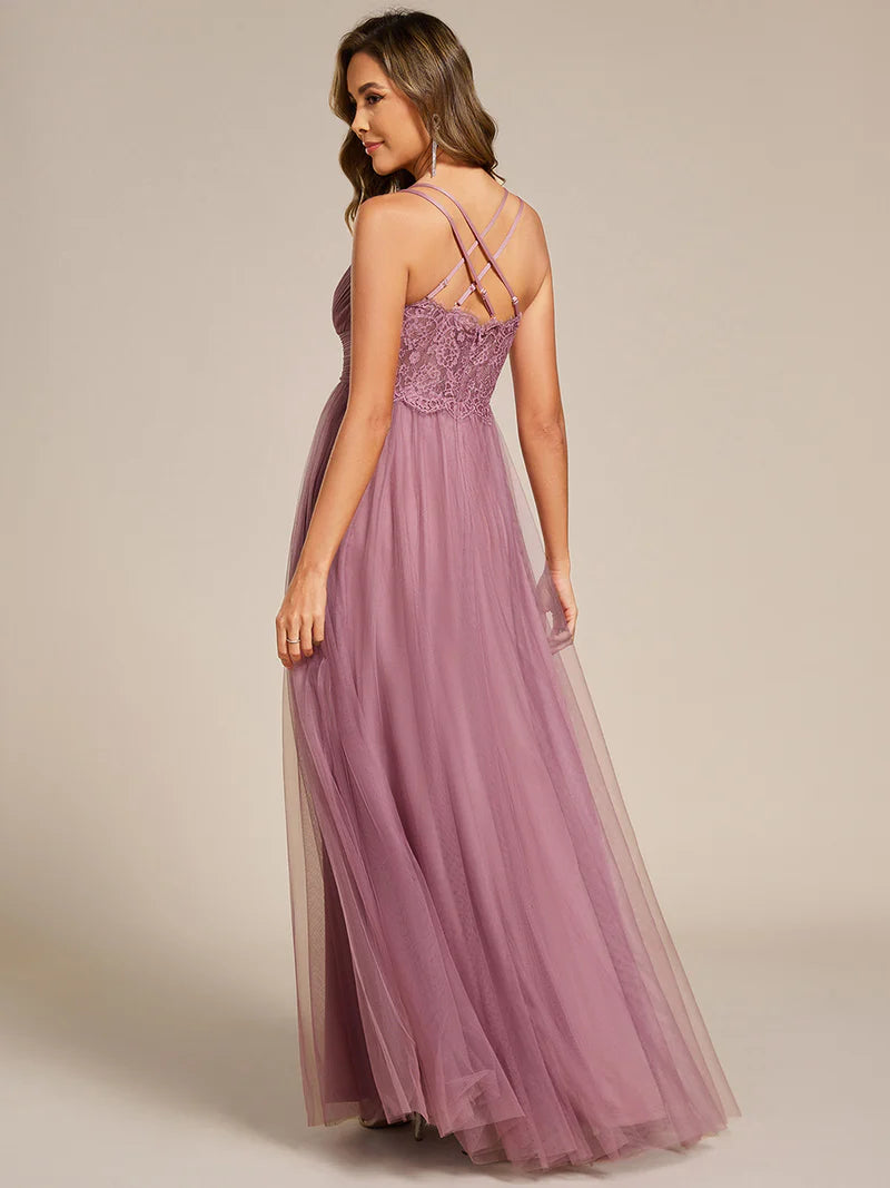 Romantic purple orchid bridesmaid dress with spaghetti straps, lace halter neckline, and open back
