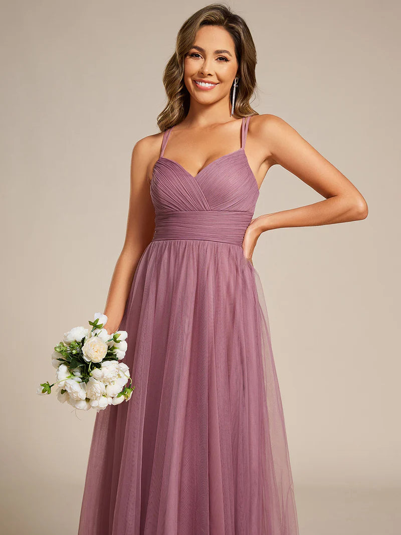 Romantic purple orchid bridesmaid dress with spaghetti straps, lace halter neckline, and open back