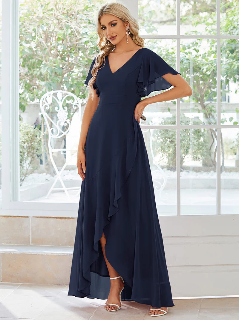 Elegant navy blue chiffon high-low gown for bridesmaids featuring V-neck and soft ruffles