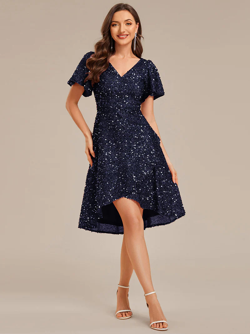 Elegant sequin high-low formal navy blue dress featuring short ruffle sleeves and a deep V-neckline – ideal for weddings, galas, or prom nights.