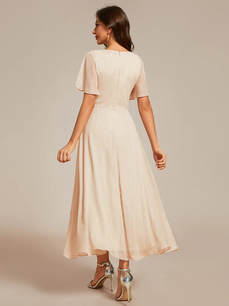 Shimmering V-neck tea length Charcoal dress with short sleeves, perfect for wedding guests