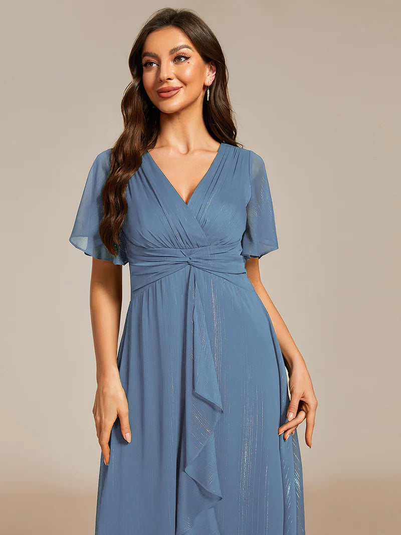 Shimmering V-neck tea length dusty blue dress with short sleeves, perfect for wedding guests