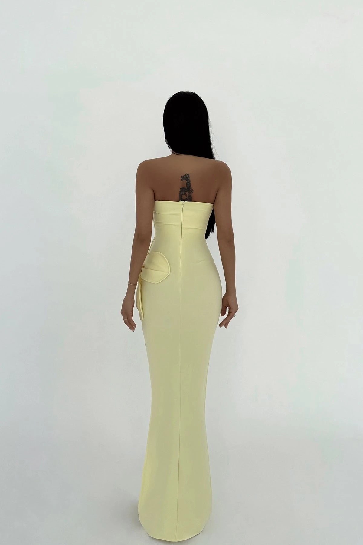 Strapless yellow maxi dress with 3D floral detailing and elegant side slit