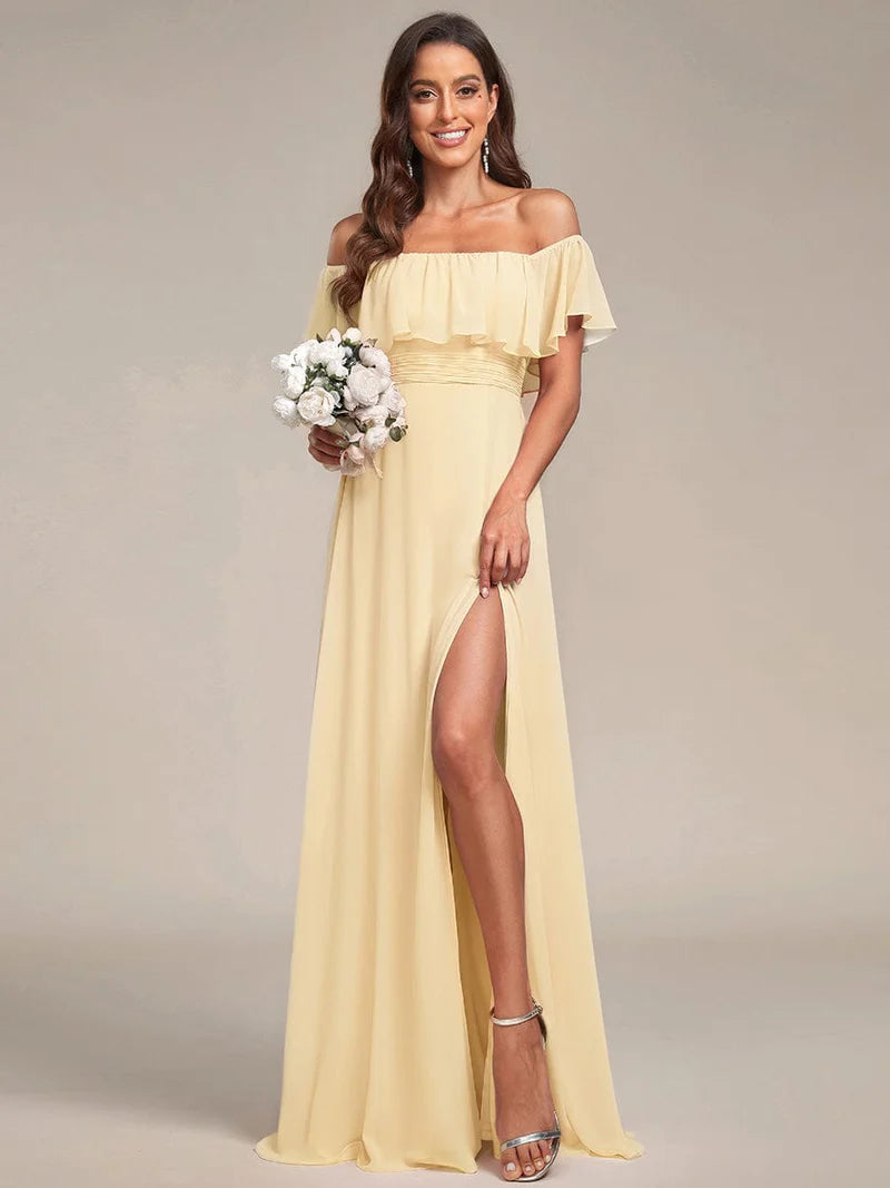 Yellow bridesmaid dress with ruffle detailing and thigh-high split