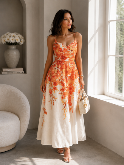 Woman in a floral dress standing in a bright room with a window and decorative items.
