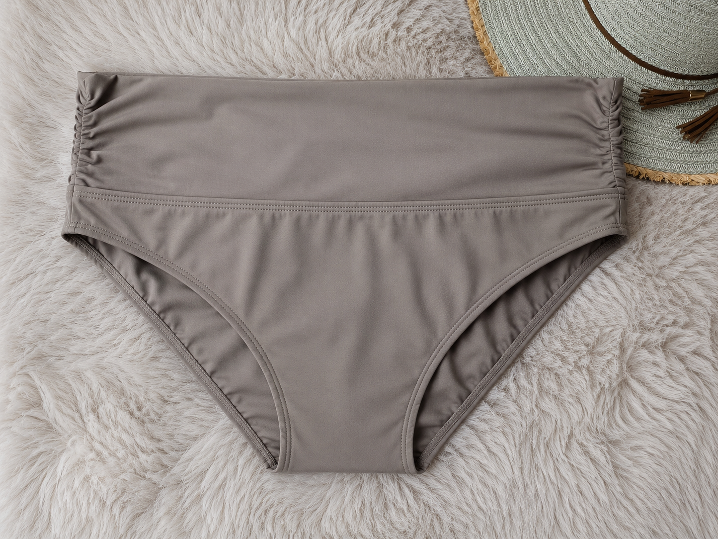 Brown bikini bottom on a textured surface