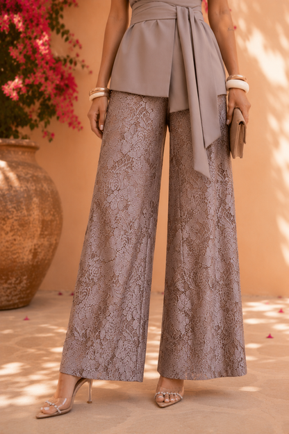 Woman wearing a gray lace outfit with a blurred background