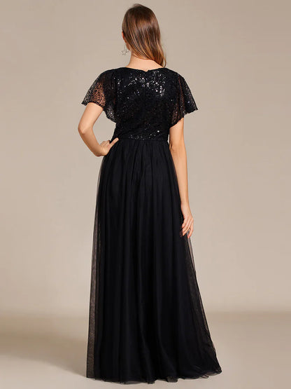 Black elegant V-neck tulle dress with ruffle sleeves, empire waist, and sparkling paillettes