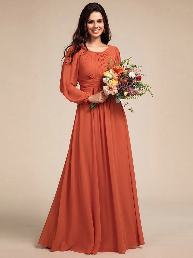 Burnt orange bridesmaid dress with round neckline and long lantern sleeves