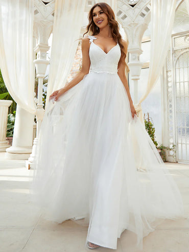 Romantic cream lace tulle wedding dress with double V-neckline and flowing skirt