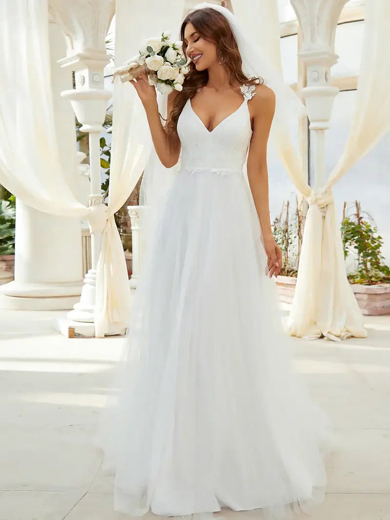 Romantic cream lace tulle wedding dress with double V-neckline and flowing skirt