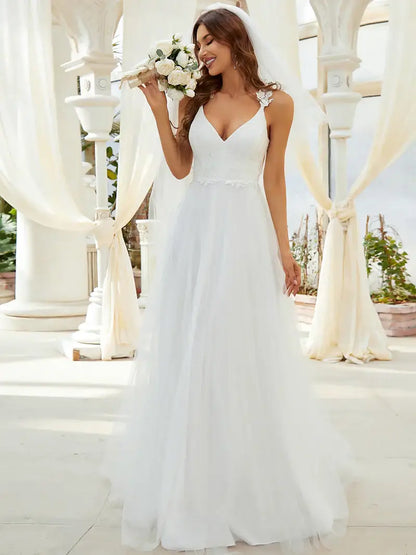 Romantic cream lace tulle wedding dress with double V-neckline and flowing skirt
