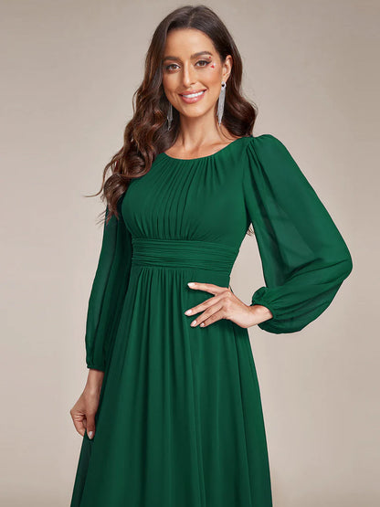 Dark green bridesmaid dress with round neckline and long lantern sleeves