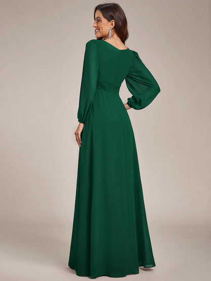 Dark green bridesmaid dress with round neckline and long lantern sleeves