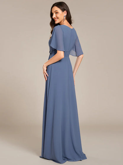 dusty a-line floor-length evening dress with short sleeves, pleated skirt, and applique embellishments