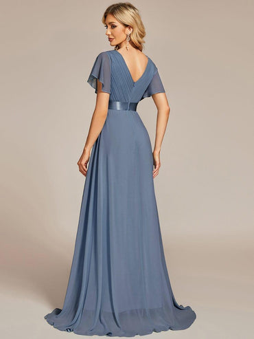 Dusty blue glamorous evening gown with double V-neckline, ruffle detailing, and padded bodice
