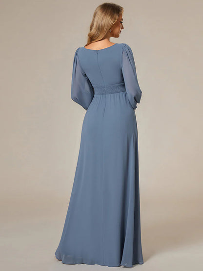 Dusty blue bridesmaid dress with round neckline and long lantern sleeves