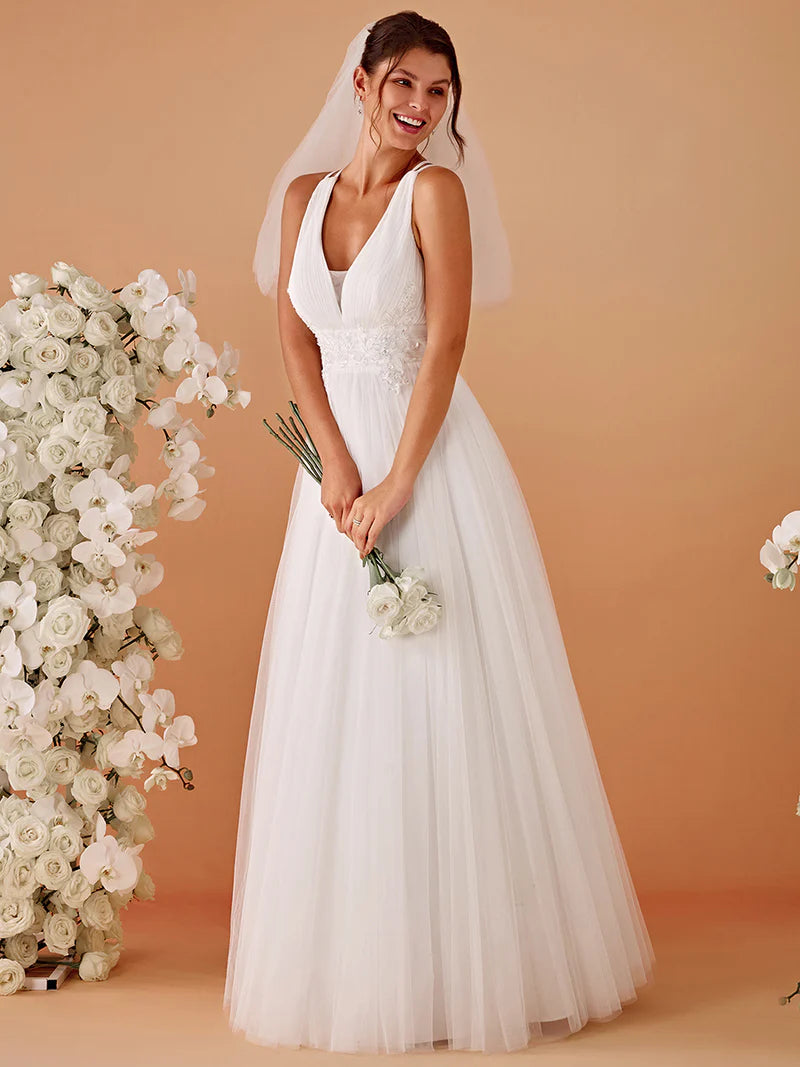 Elegant white mesh wedding dress with V-neckline, floral appliqués, and open back