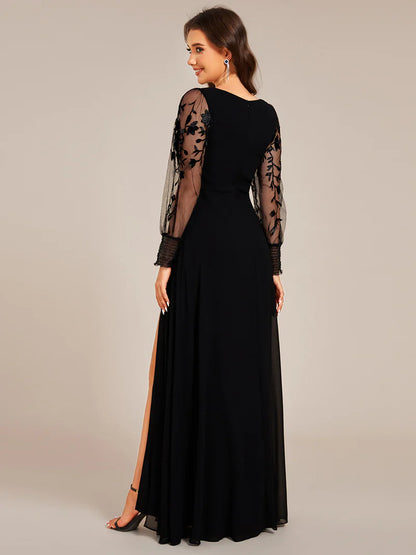 Elegant black chiffon evening dress with embroidery, sheer long sleeves, and side slit hem