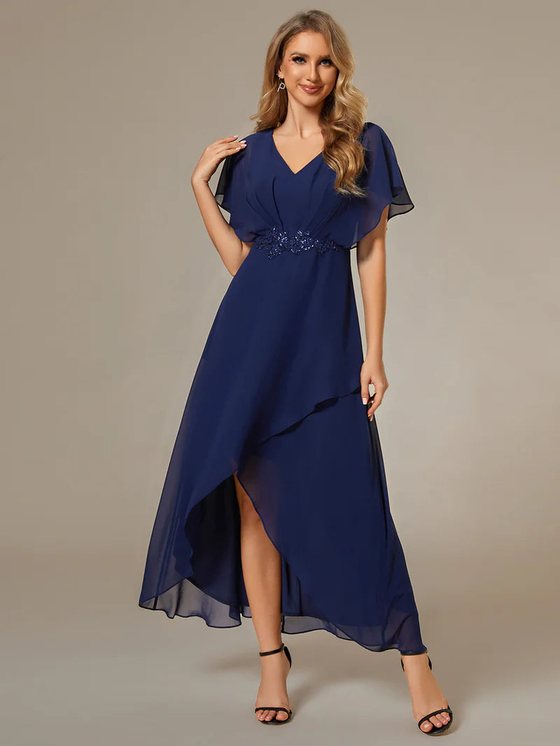 Elegant navy blue high-low gown with chiffon fabric, applique embellishments, and short sleeves