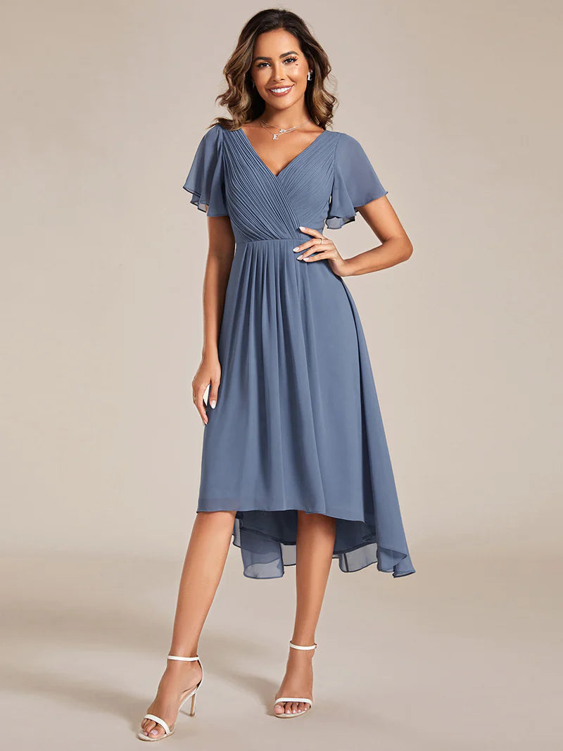 Elegant chiffon wedding guest dusty blue dress with pleated skirt and ruffle accents