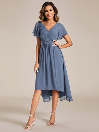 Elegant chiffon wedding guest dusty blue dress with pleated skirt and ruffle accents