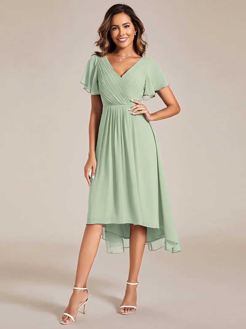 Elegant chiffon wedding guest mint green dress with pleated skirt and ruffle accents