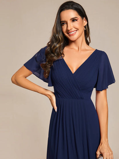 Elegant chiffon wedding guest navy blue dress with pleated skirt and ruffle accents
