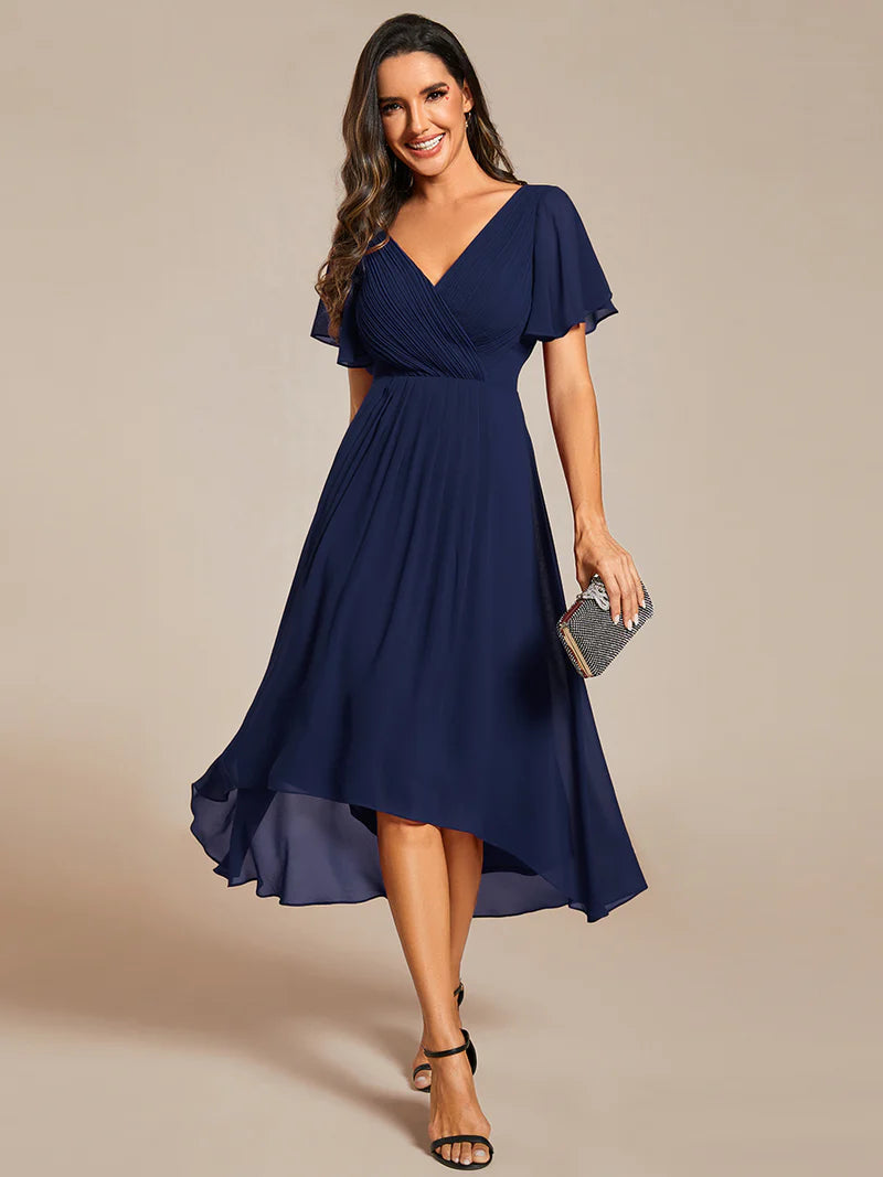Elegant chiffon wedding guest navy blue dress with pleated skirt and ruffle accents