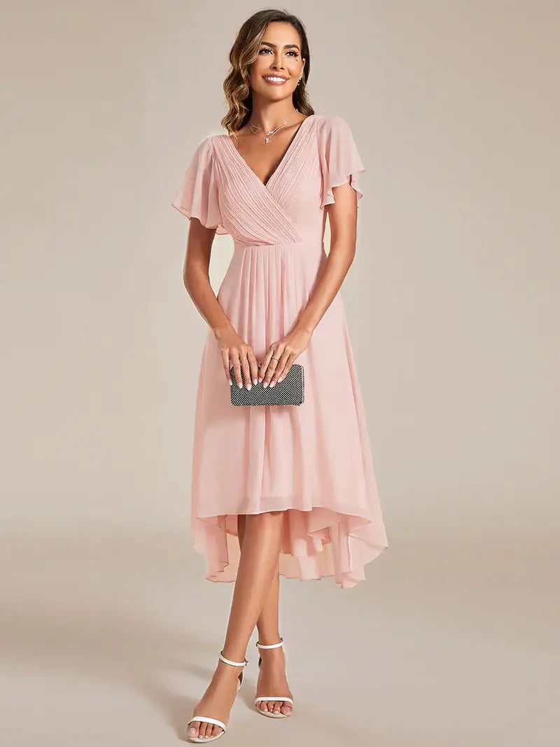 Elegant chiffon wedding guest pink dress with pleated skirt and ruffle accents