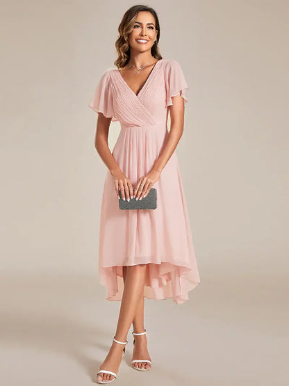 Elegant chiffon wedding guest pink dress with pleated skirt and ruffle accents