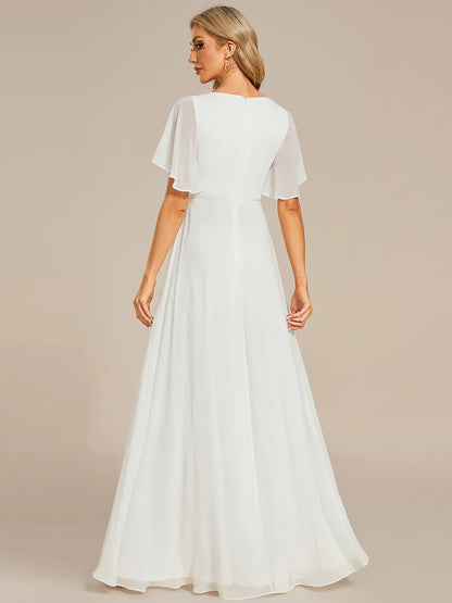 Elegant pleated bridesmaid white dress with V-neckline and floral appliqués