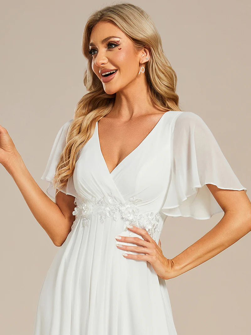 Elegant pleated bridesmaid white dress with V-neckline and floral appliqués