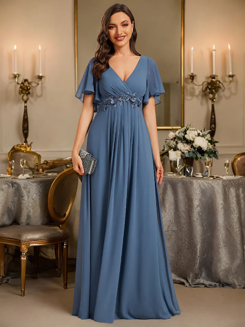 Elegant pleated bridesmaid dusty blue dress with V-neckline and floral appliqués