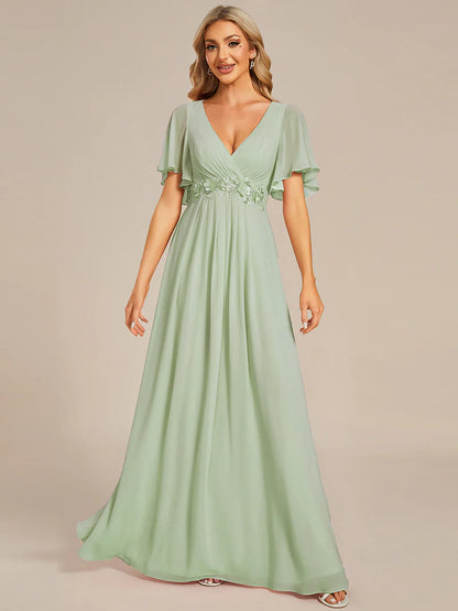 Elegant pleated bridesmaid mint green dress with V-neckline and floral appliqués