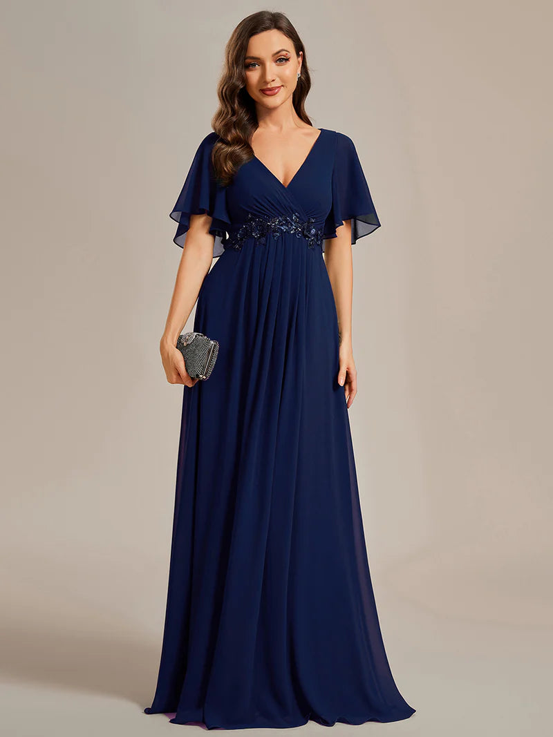Elegant pleated bridesmaid navy blue dress with V-neckline and floral appliqués