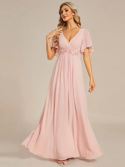 Elegant pleated bridesmaid pink dress with V-neckline and floral appliqués
