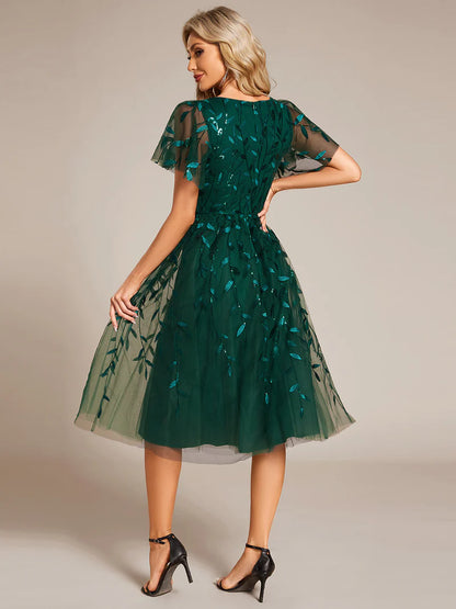 Exquisite midi length Dark Green dress with ruffled sleeves, tulle fabric, sequin details, and embroidery